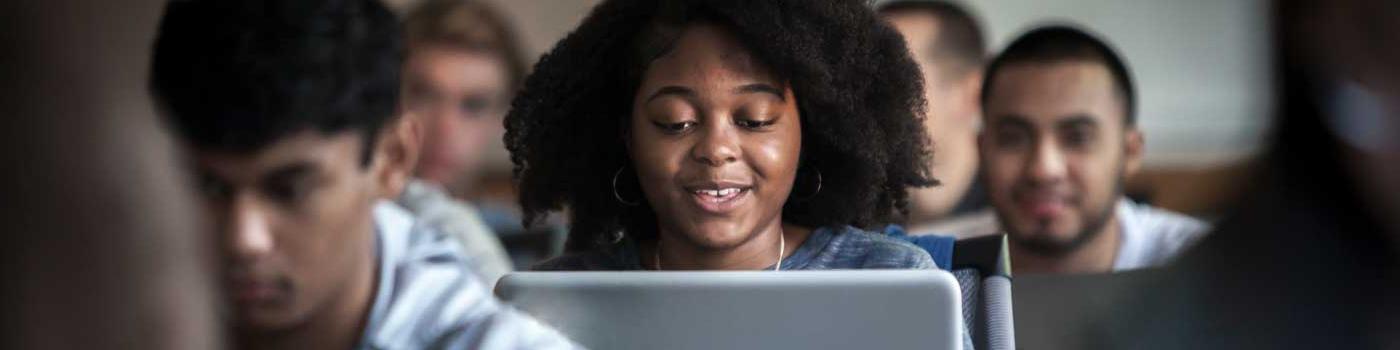 Student working in class on their laptop. 